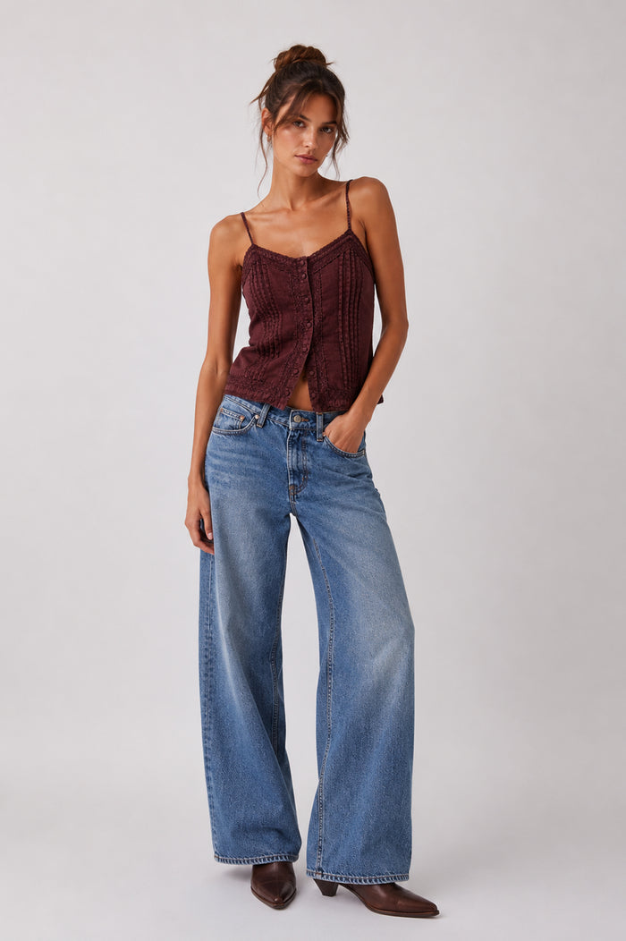 Front view of the Brown Washed Lace Tank with slim straps, lace and pintuck detailing, styled with wide-leg jeans.